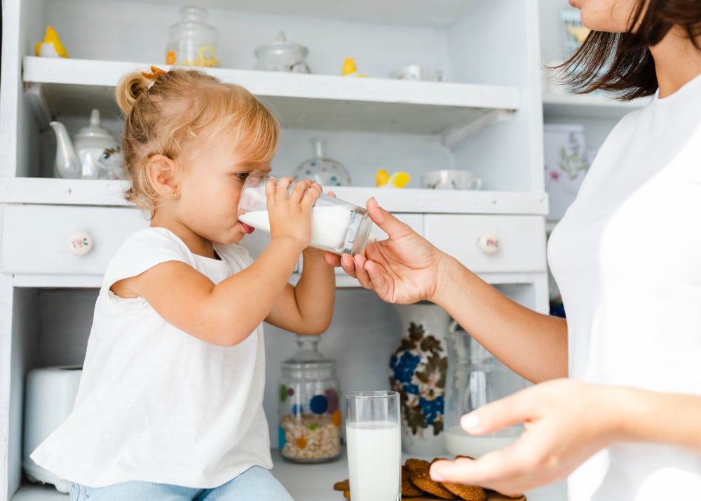 Little Girl Enjoying Milk