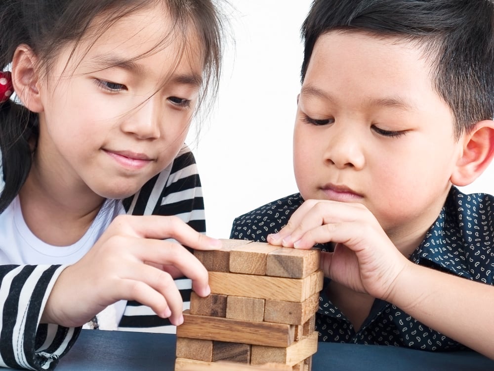 Children Engaged in a Game of Strategy