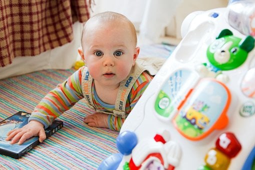 Curious Baby Exploring Colorful Toys