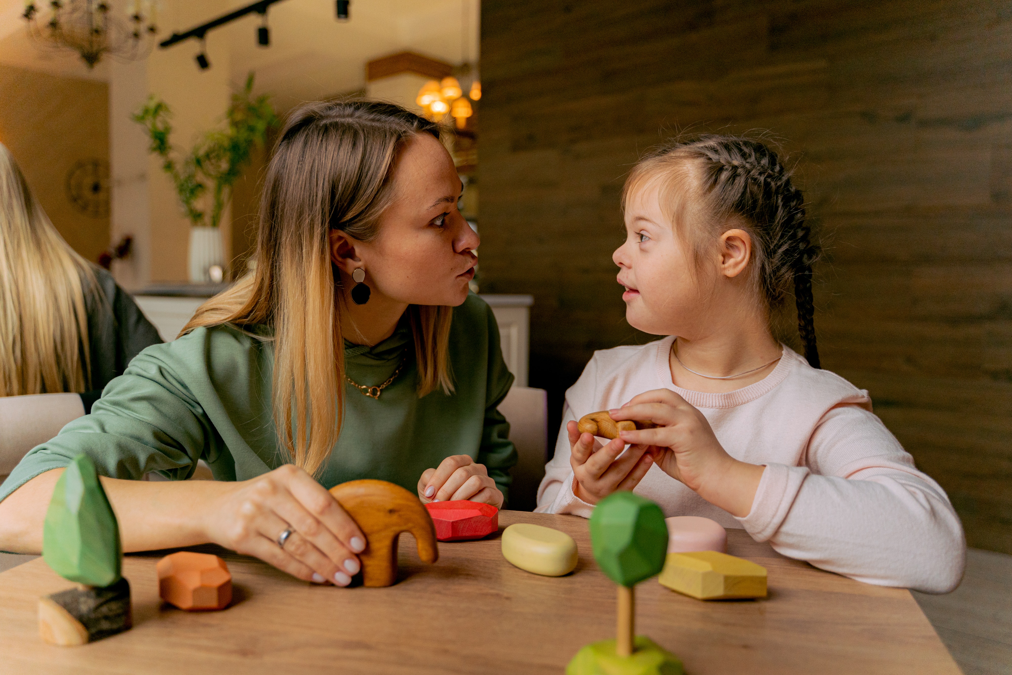 Engaging Playtime Between Mother And Daughter
