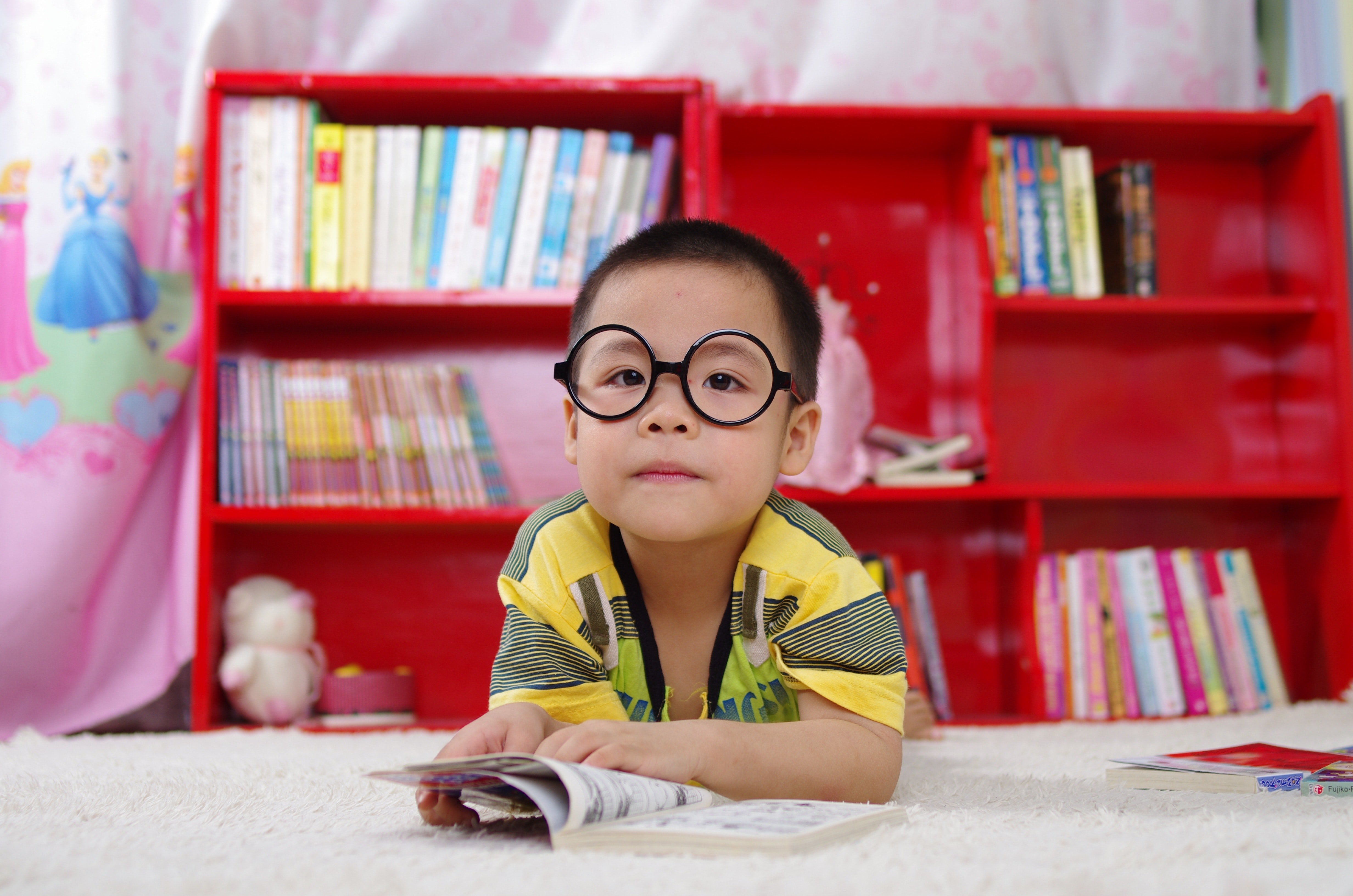 Curious Child with Big Glasses Reading